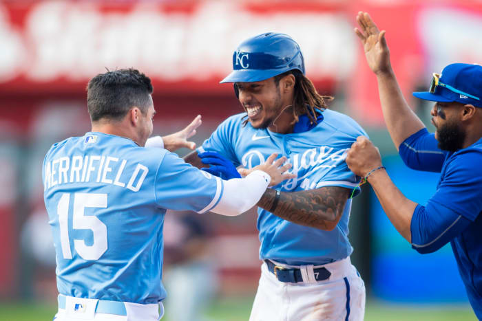 Apr 9, 2022; Kansas City, Missouri, USA; Kansas City Royals shortstop Adalberto Mondesi (27) celebrates with teammates after hitting the game winning RBI in the 10th inning against the Cleveland Guardians at Kauffman Stadium. Mandatory Credit: Nick Tre. Smith (FLO)-USA TODAY Sports